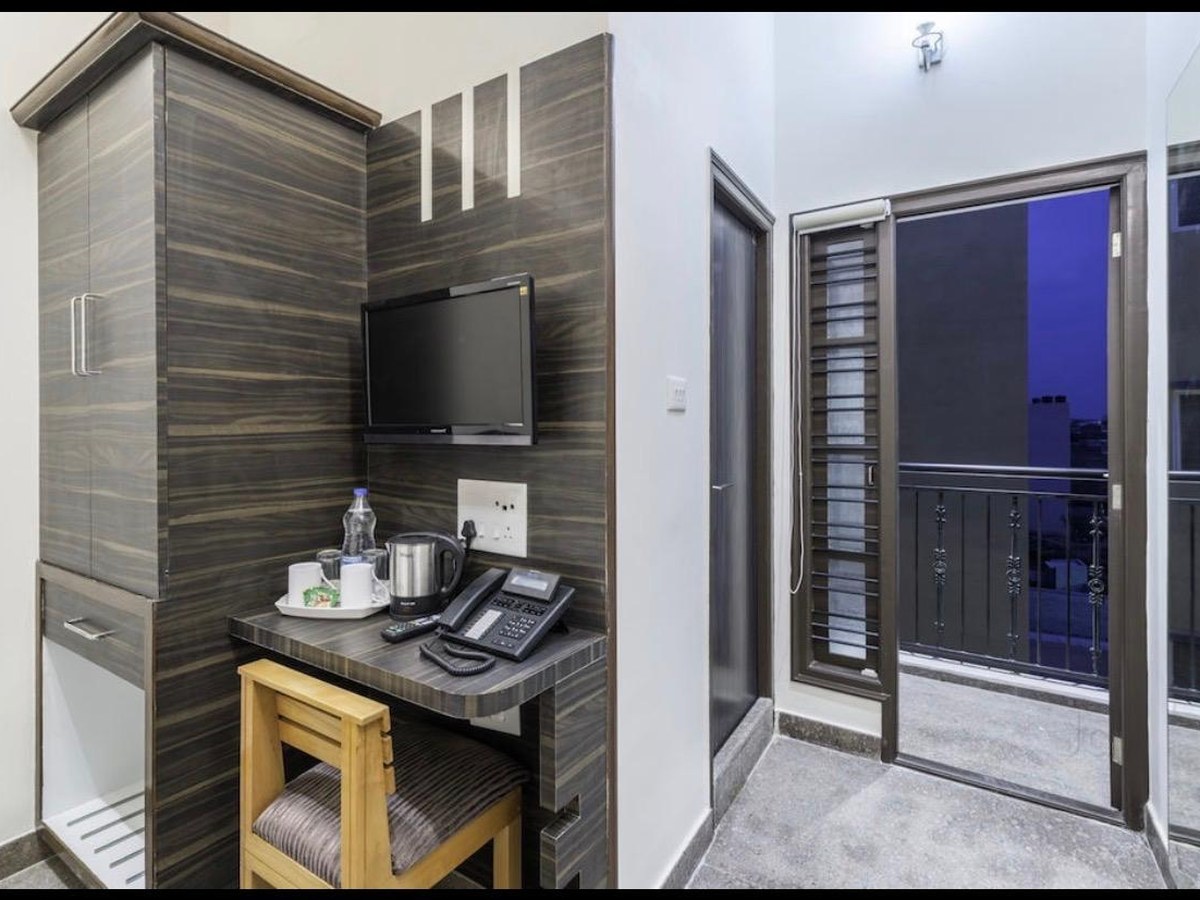 Guest room desk and balcony in the evening